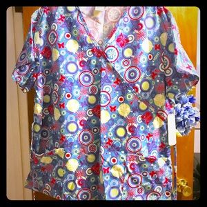 Brightly patterned new scrub top. Size 1x.